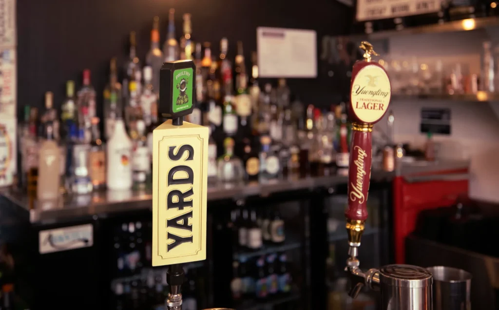 a close up of a bar with a sign on the bar