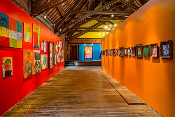 a long hallway with paintings on the walls