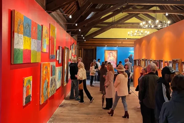 a group of people walking around a museum