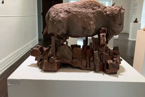 a sculpture of a rock on display in a museum