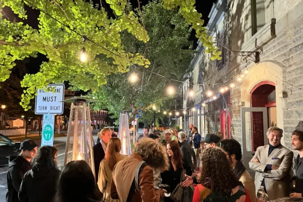 a group of people standing outside of a building